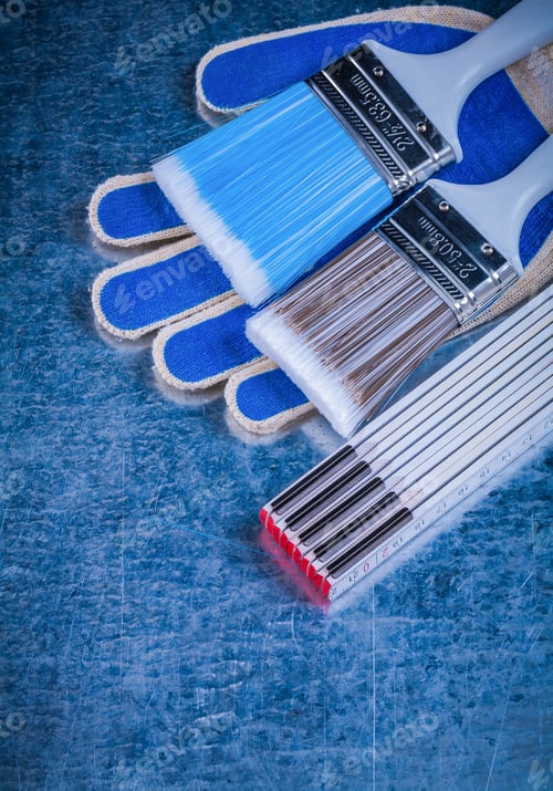 Preview: Wooden Meter Paintbrushes Working Gloves On Metallic Background Top View.