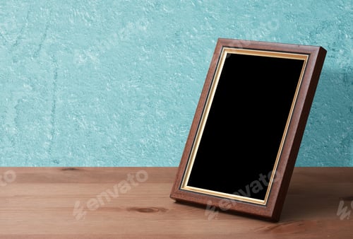 Preview: Wooden Photo Frame On Table, Blue Wall