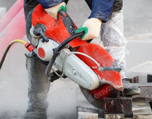Preview: Construction Worker Operated Circular Saw With A Diamond Blade For Cutting Asphalt And Concrete