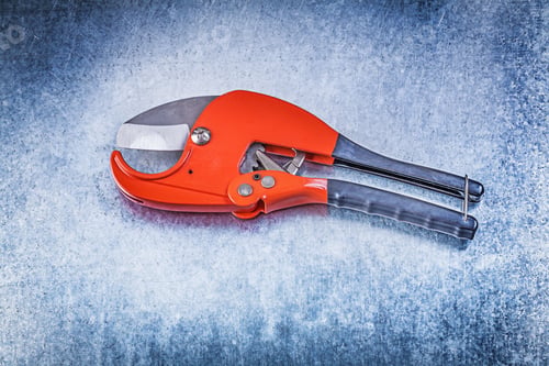 Preview: Pipe Cutter On Metallic Background Construction Concept.