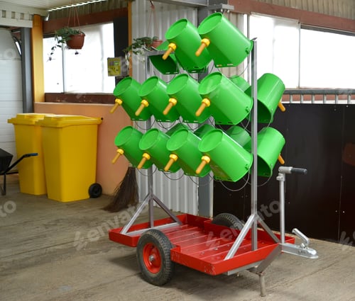 Preview: Mobile Rack With Plastic Buckets For Unsoldering Of Calfs. Dairy Farm