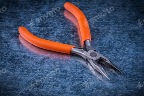 Preview: Insulated Electric Metal Gripping Tongs On Metallic Background Electricity Concept.