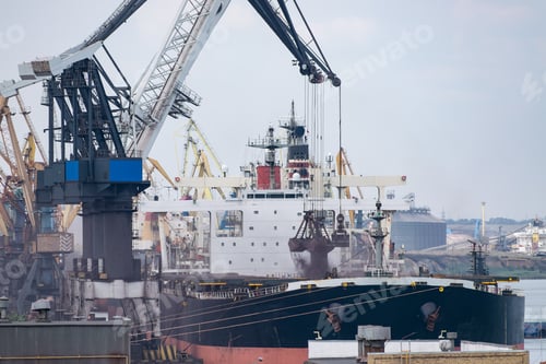 Preview: Cranes At The Cargo Sea Port Loading The Bulk Carrier With Iron Ore Or Coal