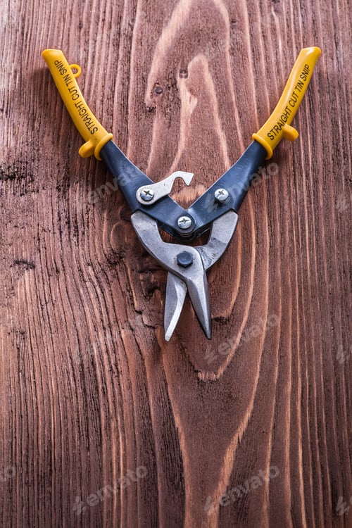 Preview: Open Metal Nippers On Vintage Wood Board Construction Concept