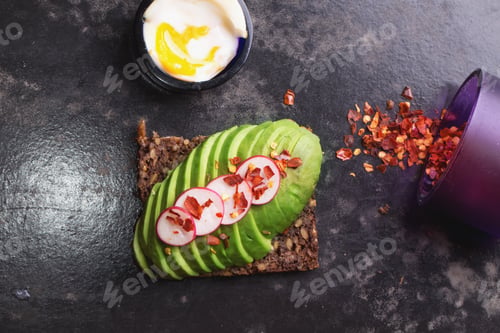 Preview: Open Sandwich: Avocado With Raddish And Chili Flakes, Soft Boiled Egg And Chili Flakes In A Bowl
