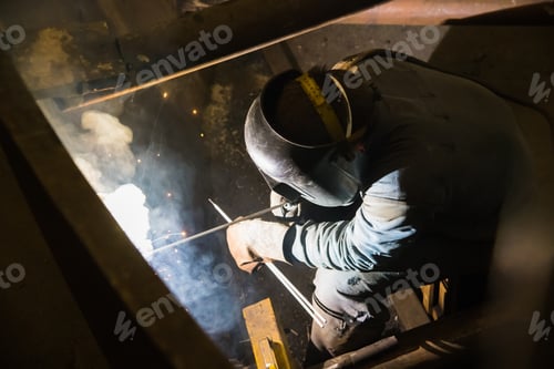 Preview: Sparks While Welder Uses Torch To Welding
