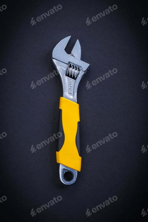 Preview: Aerial View Classical Little Adjustable Wrench On Black Background