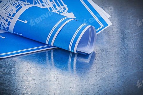 Preview: Blue Blueprints On Scratched Metallic Background Construction Concept.