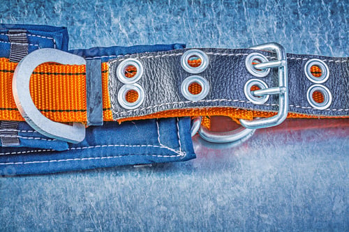 Preview: Construction Body Safety Belt On Scratched Metallic Background.