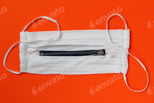 Preview: White Unusual Medical Mask With A Zipper On An Orange Background.