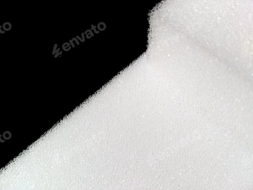 Preview: White Sponge Foam On A Dark Background