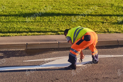 Preview: A Road Worker Draws Markings On The Asphalt With White Paint