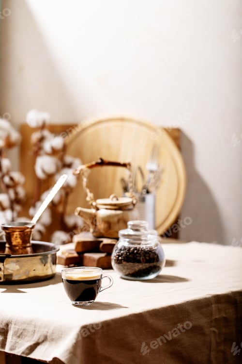 Preview: Fresh Coffee In Glass Cup Over Brown Texture Background. Top View, Flat Lay