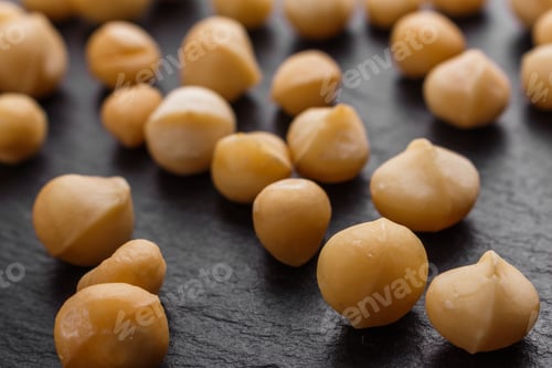 Preview: Delicious Macadamia Nuts On A Dark Stone Background