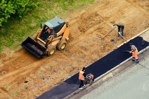 Preview: Road Worker Using A Small Bulldozer And Workers With Shovels