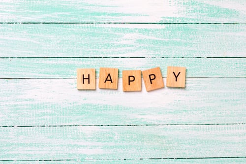 Preview: Word Happy Made From Wooden Blocks On Turquoise Wooden Background. Top View. Inspirationa Concept