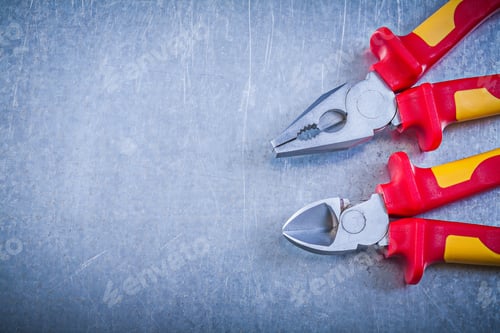 Preview: Pliers Nippers On Metallic Background Copyspace Electricity Concept.