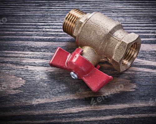 Preview: Brass Gate Valve On Wooden Background Plumbing Concept.
