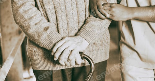 Preview: Elderly Man With Walking Stick Moving With Nurse, Detail On The Hands.