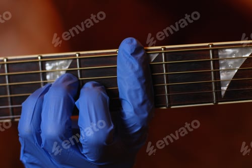 Preview: A Musician Plays With Gloves On A Musical Instrument In An Audio Studio. The Life Of A Guitarist In