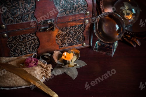 Preview: A Fortune Teller, Witch Stuff On A Table, Candles And Fortune-Telling Objects. The Concept Of