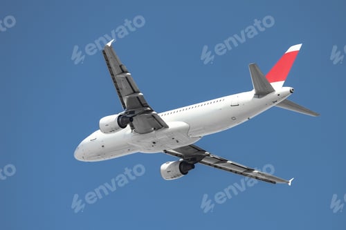 Preview: Passenger Airplane In The Sky With Blue Background