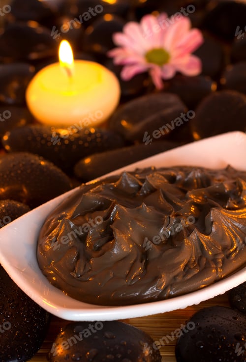 Preview: Spa Treatment. Clay, Burning Candle, Spa Stones, Pink Flowers.
