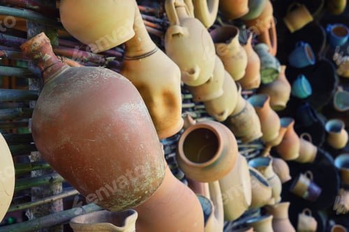 Preview: Rustic Vintage Clay Jugs, Pots And Mugs Hanging On The Wall.