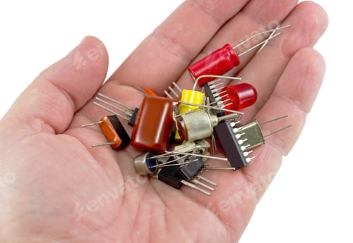Vista previa: Miniature Elctronic Circuit Board On Hand On White Background
