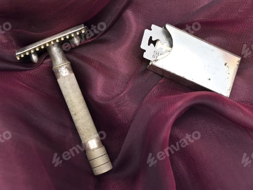 Preview: Old Shaver And Razor At Dark Red Fabric