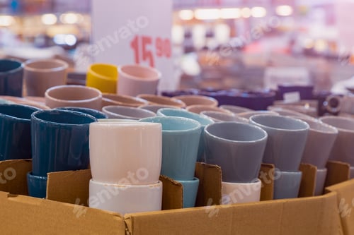 Preview: New Cups Or Mugs On The Store Shelf. Selective Focus With Blurred Background.