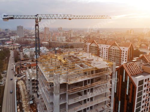 Preview: Busy Construction Site And Construction Equipment Aerial Photo At Sunset.