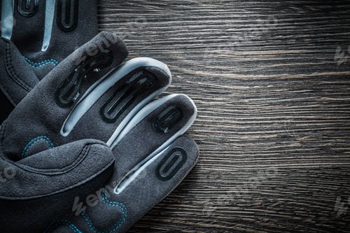 Preview: Pair Of Construction Gloves On Wooden Board.