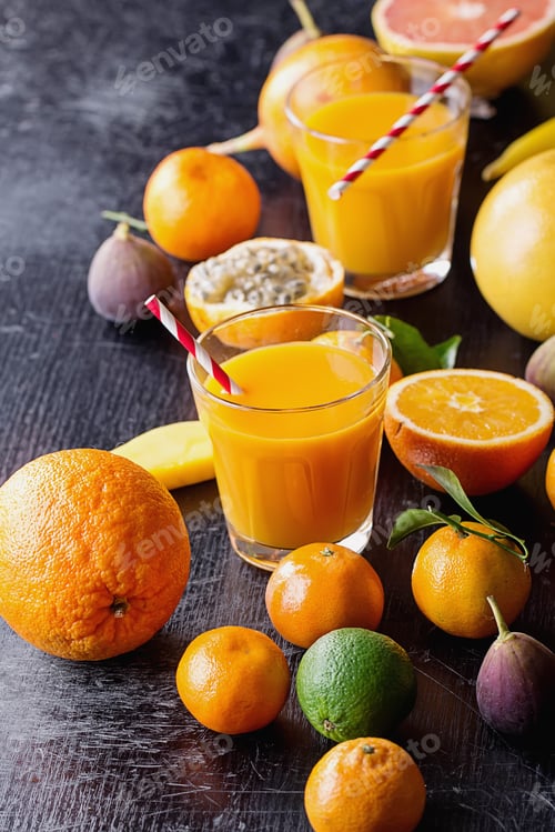 Preview: Variety Of Citrus Tropical Fruit With A Glass Of Orange Juice With A Paper Straw: Tangerines