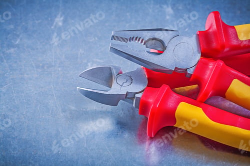 Preview: Metal Pliers Nippers On Metallic Background Electricity Concept.