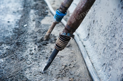 Preview: Road Worker Removes Old Asphalt With A Jackhammer During Road Construction
