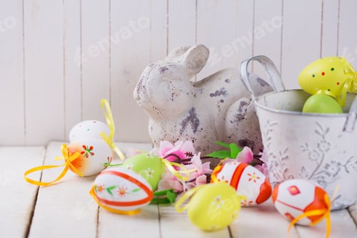 Preview: Easter Rabbit And Eggs On White Wooden Background. Easter Background.