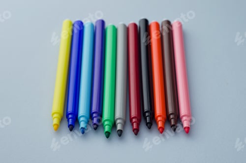 Preview: Multiple Colorful Magic Markers Over Blue Background