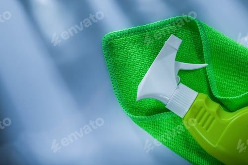 Preview: Green Washing Cloth Sprayer On White Surface.