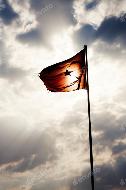 Preview: Flag Against Dramatic Sky Silhouette