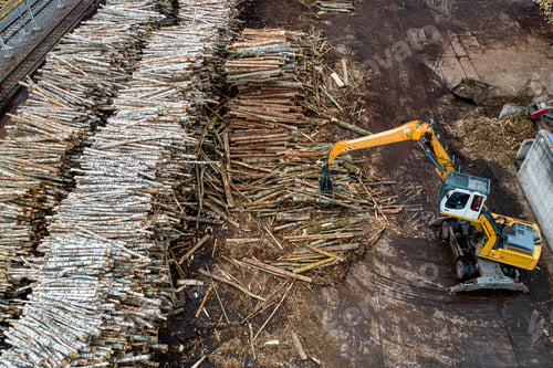 Preview: A Loader Loads Logs At A Wood Processing Factory From Above From A Drone