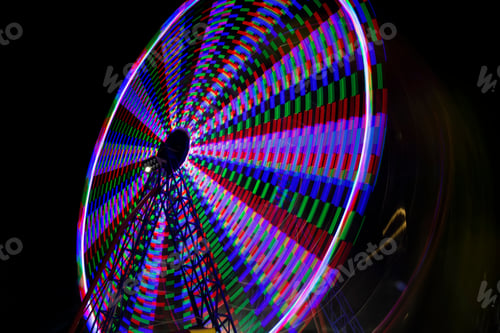 Preview: Ferris Wheel Moving At Night. Wheel Fun With Illumination Against Dark Night Sky.