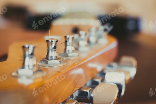 Preview: Electric Guitar Headstock And Tuning Peg Detail With Light Effect, Selective Focus
