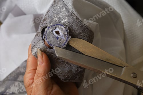 Preview: The Process Of Scissors Cutting Holes For Eyelets Curtains.