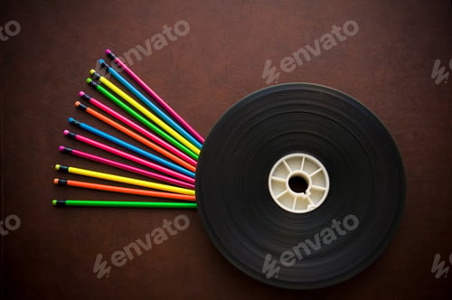 Preview: Wooden Writer Desktop With Colorful Pencil And Movie Film Reel