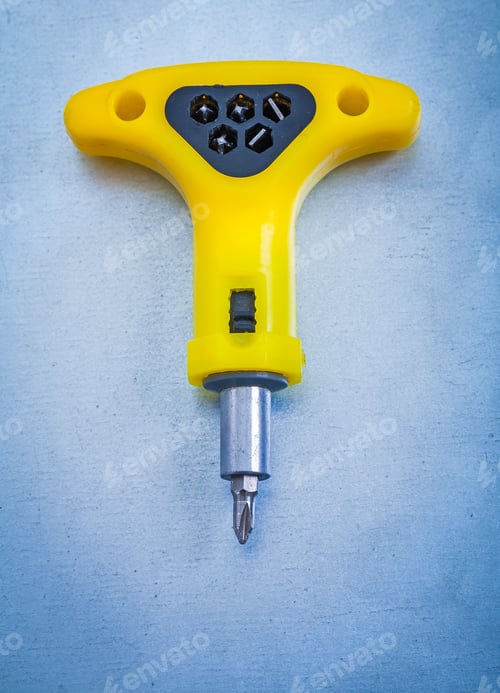 Preview: Insulated Electric Yellow Screwdriver On Metallic Background Construction Concept
