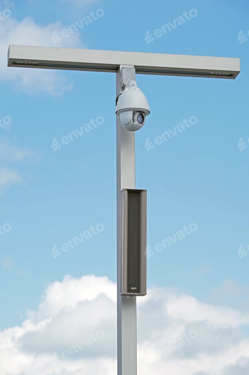 Preview: Ip Security Camera And Led Street Lantern Mounted On Post Against The Blue Sky