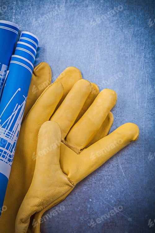 Preview: Leather Yellow Safety Gloves Blue Blueprints On Metallic Background.