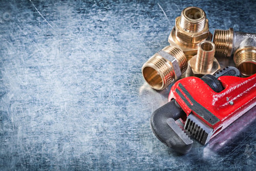 Preview: Monkey Wrench Brass Nipple Hose Connectors On Metallic Background Plumbing Concept.