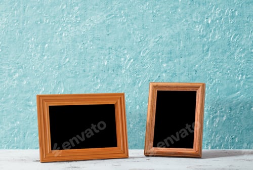 Preview: Wooden Photo Frames On Table, Blue Wall